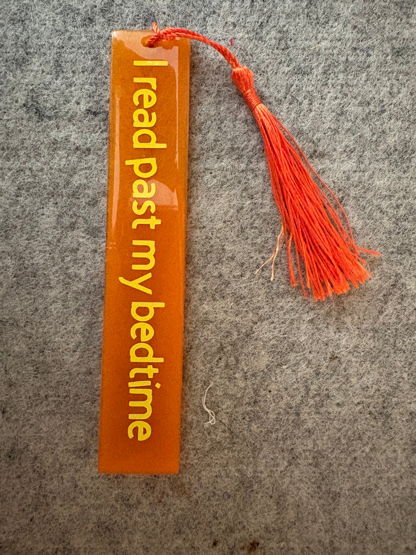 Orange resin book mark